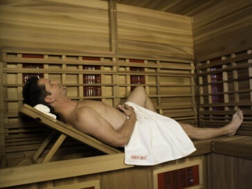 guy reclining in sauna