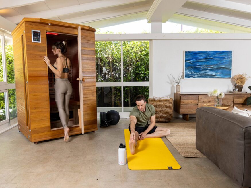 A couple working out and detoxing in their Health Mate infrared sauna