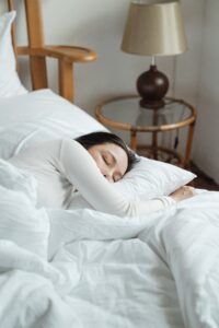 Woman fast asleep in bed