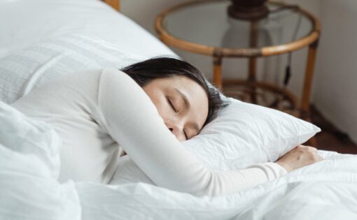 woman fast asleep in bed